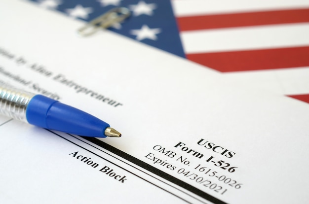 A close-up of a United States tax form (e.g., Form 1040) with a pen pointing to a section about tax credits. The form is partially filled out, suggesting someone is in the process of claiming credits. A calculator is visible in the background, highlighting the financial aspect.