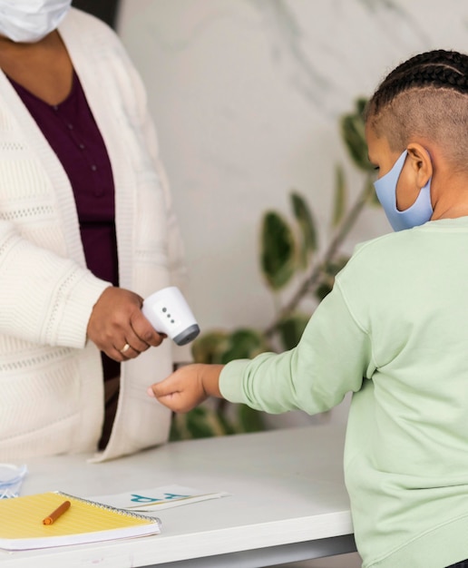 A doctor examining a child, representing access to healthcare through Medicaid or CHIP.