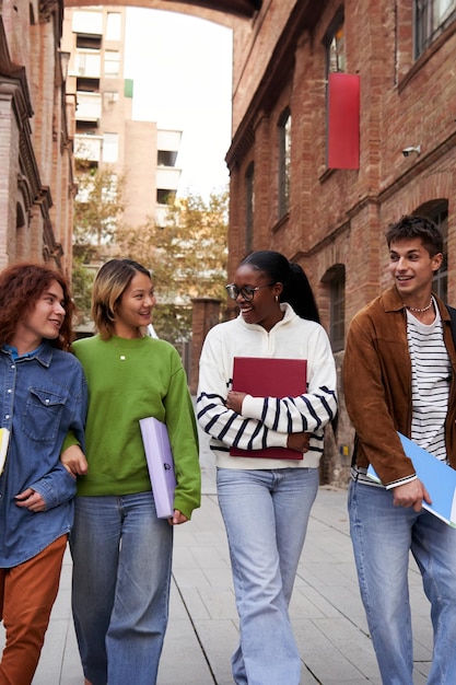 A diverse group of students walking on a college campus, highlighting the accessibility of education and the role of tax credits in supporting it.