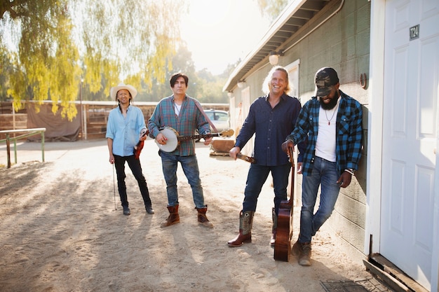 A group of construction workers building a new community center in a low-income neighborhood, funded by the New Markets Tax Credit program. The image should emphasize the job creation and community development aspects of NMTC investments.