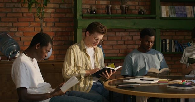 Students using tablets or laptops in a library or media center, working on research projects or collaborating on assignments. The environment is quiet and focused, with students engaged in their work.