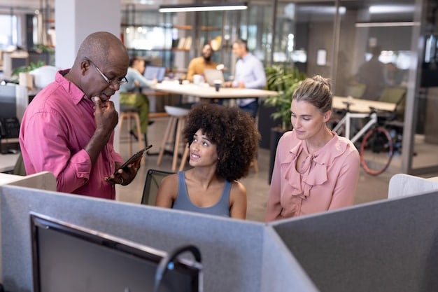 A diverse team of professionals collaborating in a modern, eco-friendly office space, representing the importance of social and governance factors in ESG investing.
