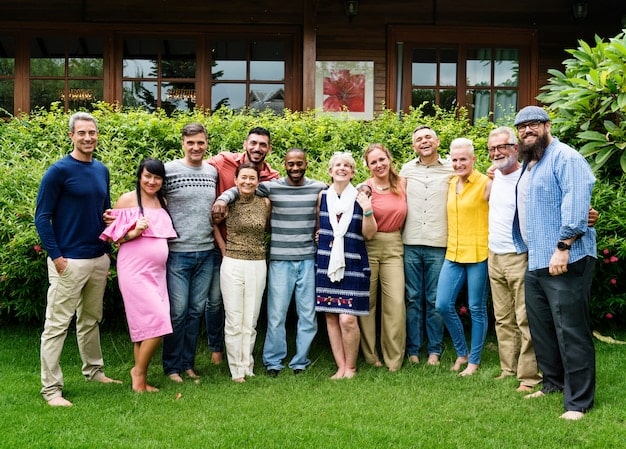 A diverse group of people gathered at a community center, representing the various individuals and families who can benefit from the Energy Assistance Program. The atmosphere should be welcoming and inclusive.