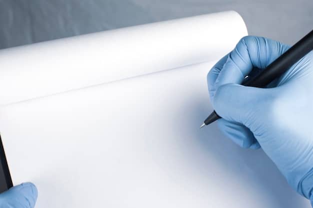 A close-up of a hand holding a stack of neatly organized medical records, with a pen resting on top.