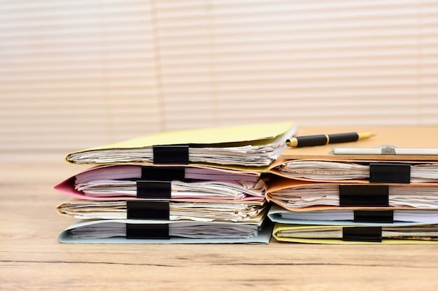 A close-up of organized documents and files on a desk, highlighting the importance of gathering and presenting relevant evidence for an appeal.