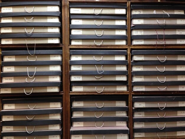 A visually organized filing cabinet with labeled folders representing payroll records, tax filings, and government orders, illustrating the importance of maintaining thorough documentation for the Employee Retention Tax Credit claim process.