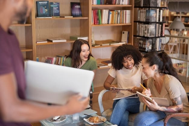 A diverse group of students studying together in a modern university library, with sunlight streaming through the windows, creating a collaborative and inspiring learning environment.