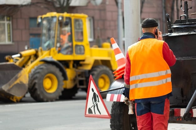 Construction workers operating heavy machinery to repair a damaged road. The setting includes orange cones and warning signs, underscoring the ongoing effort to rehabilitate America's infrastructure.