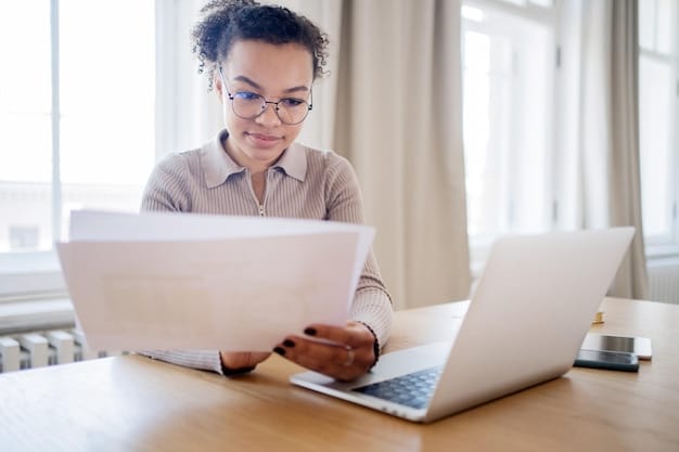 A person using a laptop to file their taxes online, with a focused and determined expression. The screen shows a tax preparation software interface, and a cup of coffee and a notepad are beside the laptop, indicating a thorough and careful process.